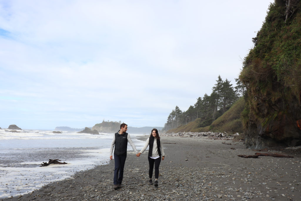 Couple holding hands at Ruby beach 