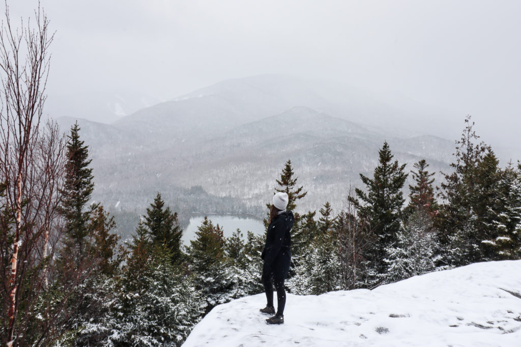 Woman standing at summit on Mount Jo hike