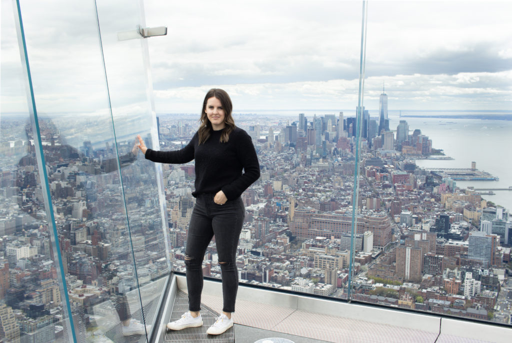 Woman posing on The Edge for Instagram photos