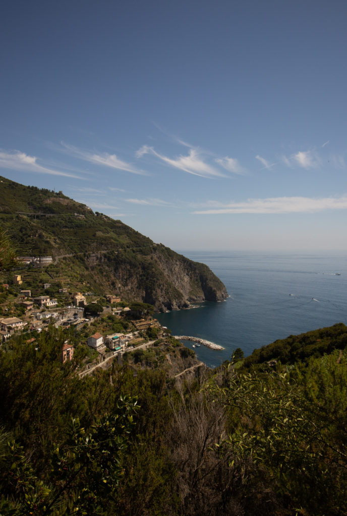 An overlooking view of one of the Cinque Terre towns along the coast.