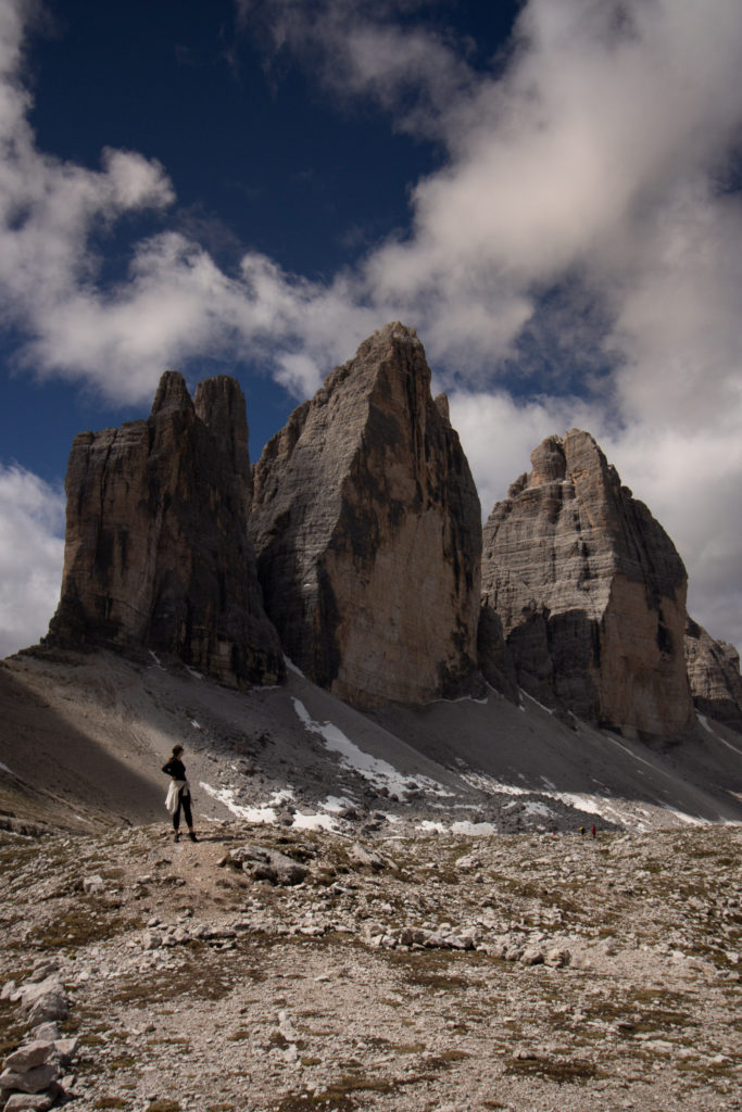 A women hiking in the Dolomites, Tre Cime di Lavaredo in the background