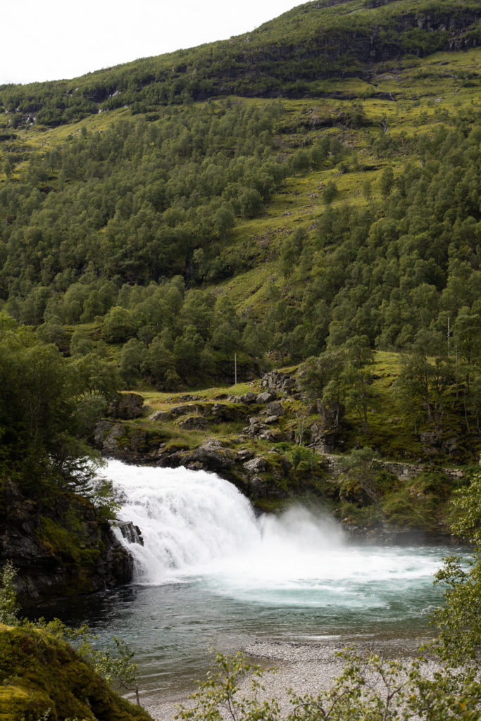 A small, wide, waterfall in the Flåm Norway valley